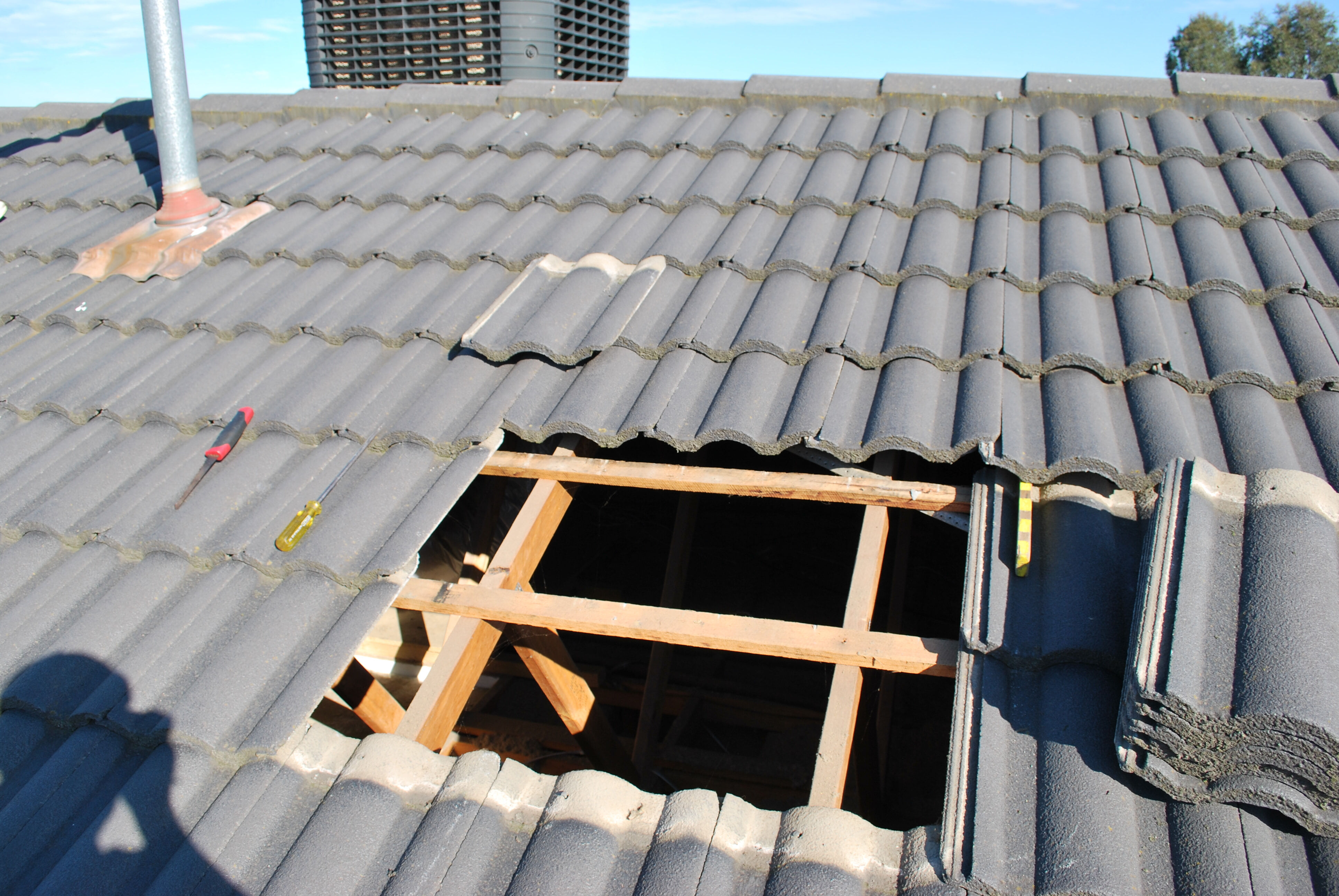 Install duct pipe to rangehood through the roof tiles 2